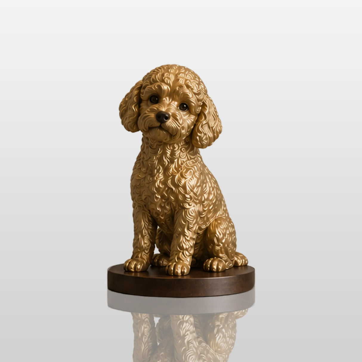 Golden bronze sitting poodle statue rests on marble entry console beside dried flower glass vase.