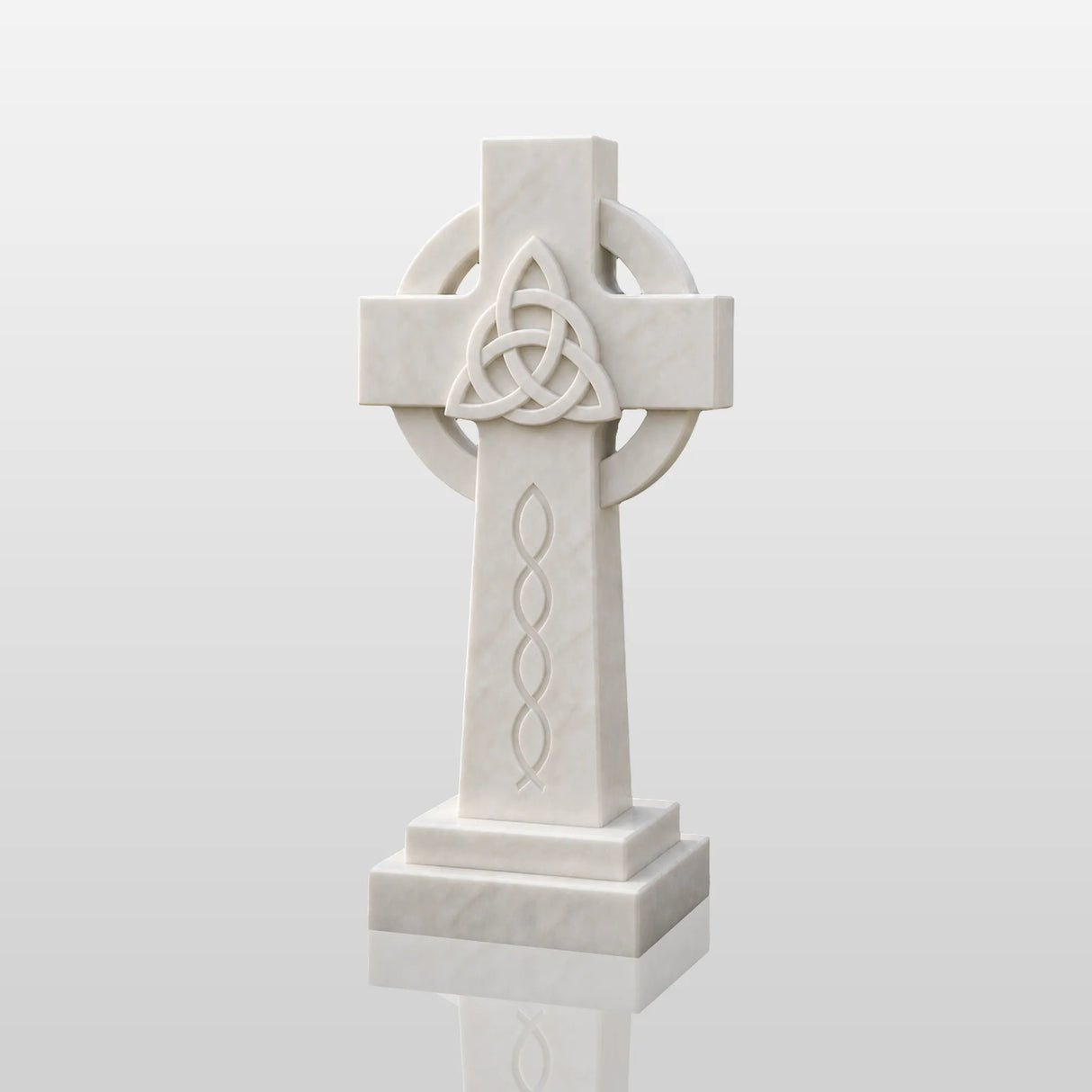 The marble Celtic cross headstone sits on dark gravel among green garden shrubs.