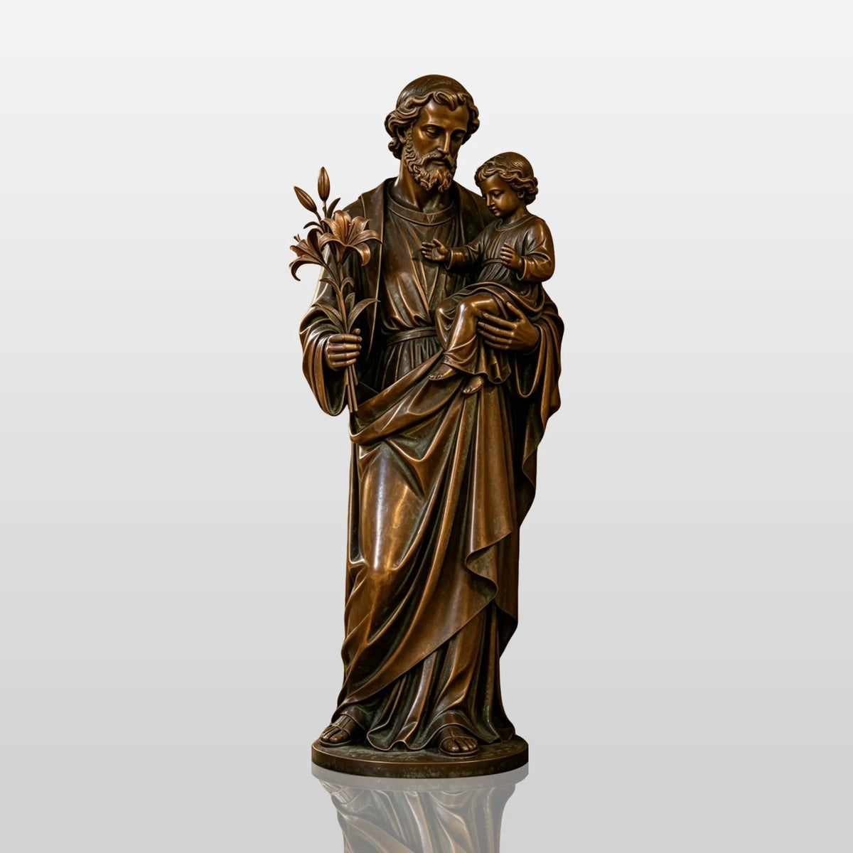 A bronze saint Joseph statue with baby Jesus and lilies stands inside a church hall.