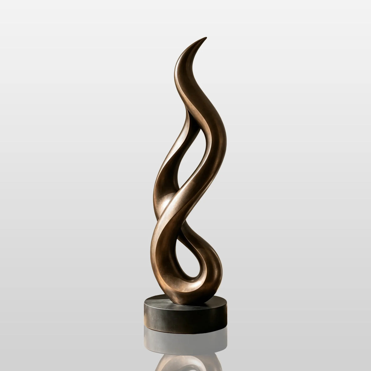 A tall twisted bronze sculpture stands in a bright modern living room beside a fireplace.