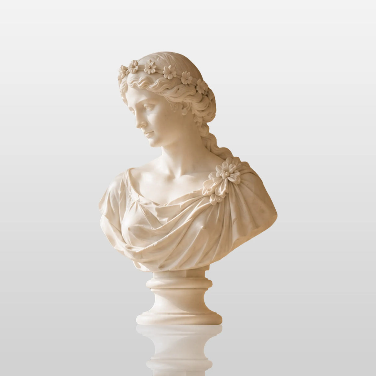 White marble flower crown lady bust stands on carved stone mantel.