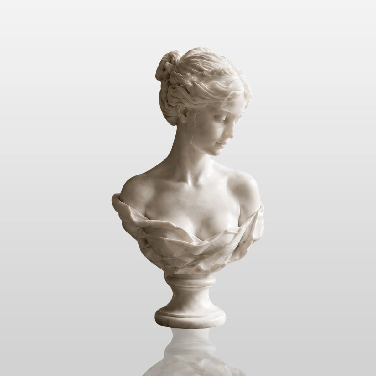 White marble female bust statue sits on a dark marble table in a refined indoor room.