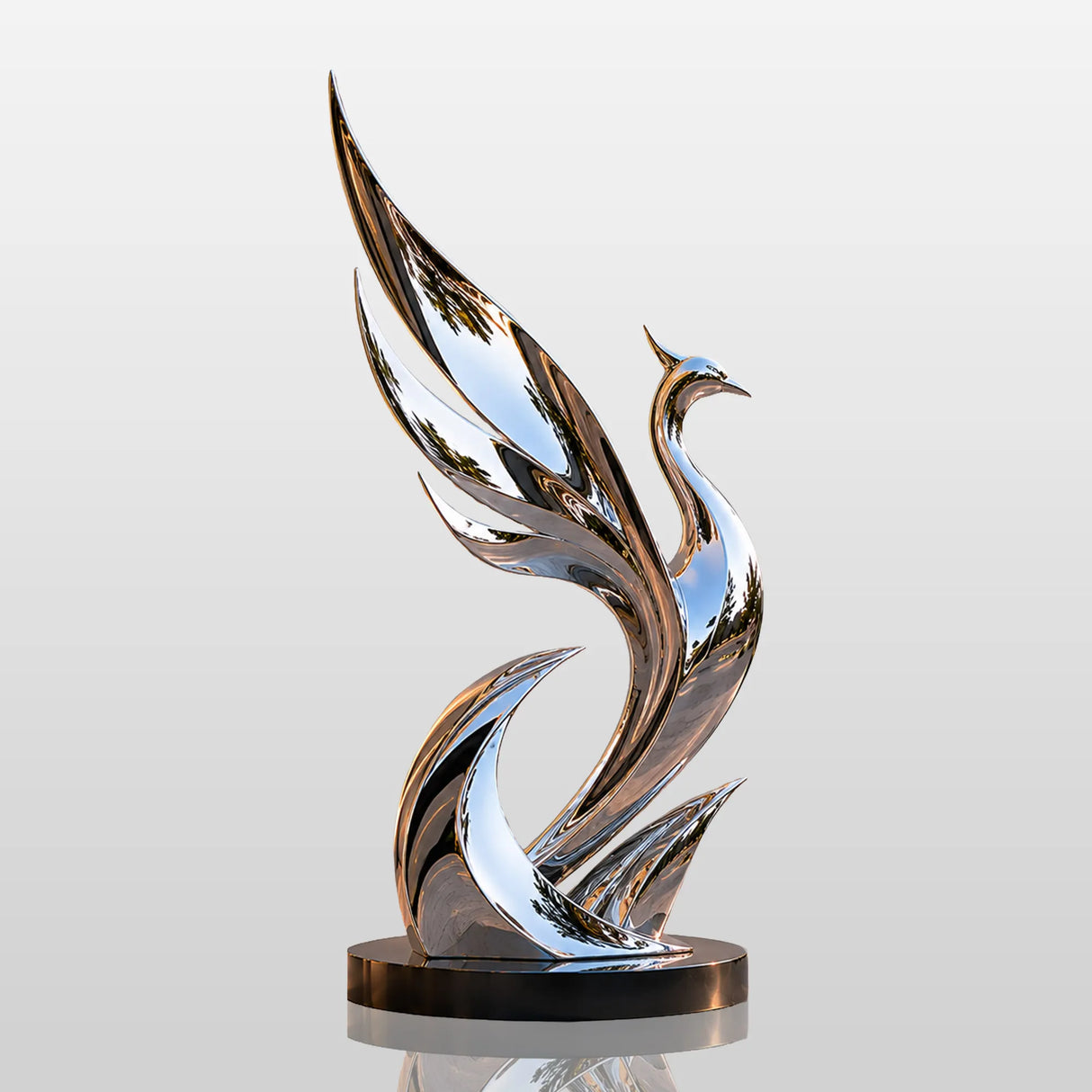 Mirror polished abstract phoenix stainless steel sculpture sits on the patio under warm dusk light.