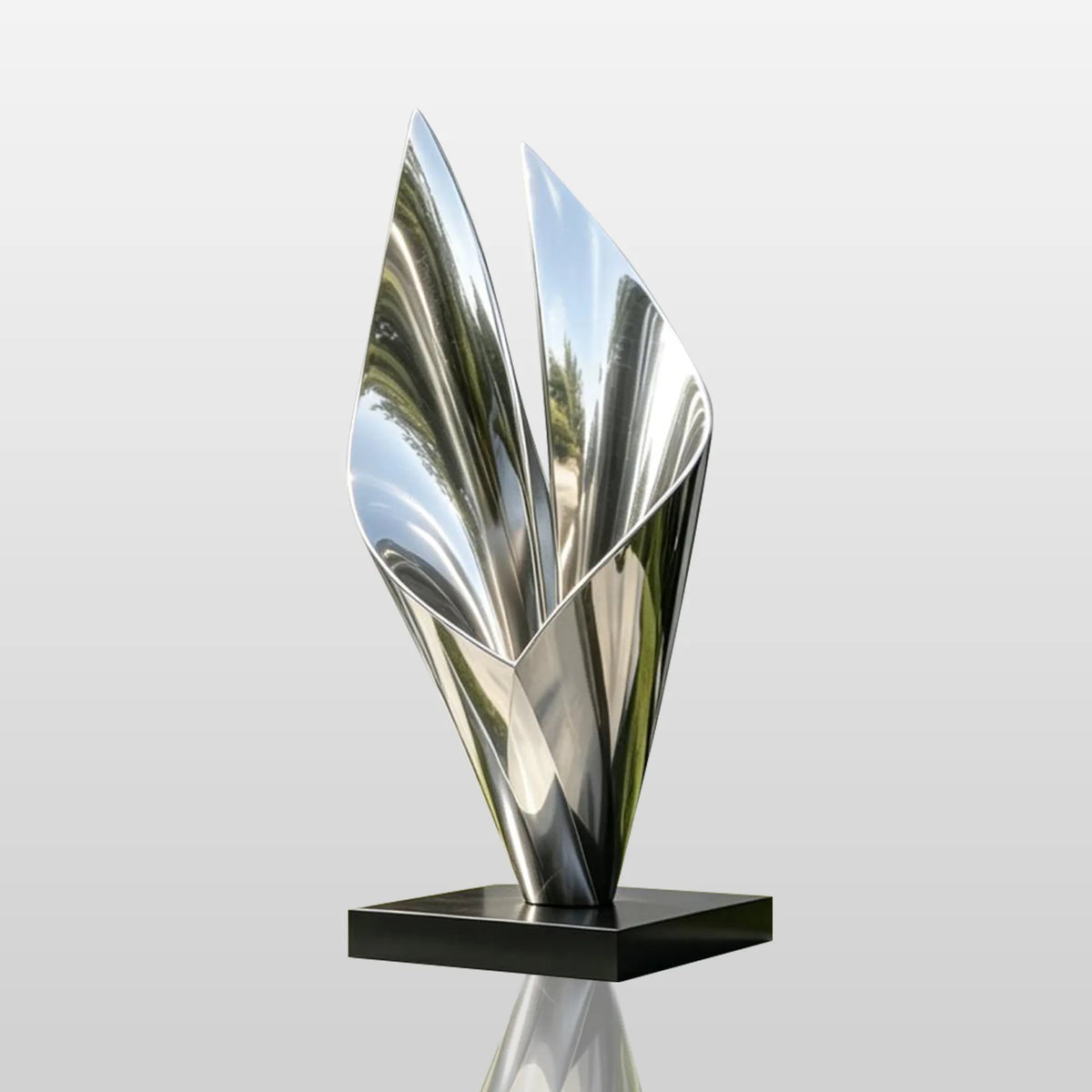 A polished stainless steel sail sculpture is set in front of a modern house.