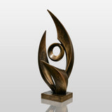 An abstract bronze sculpture rests on a white pedestal inside an art gallery.