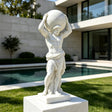 A marble atlas mythology statue stands on a stone pedestal beside a swimming pool.