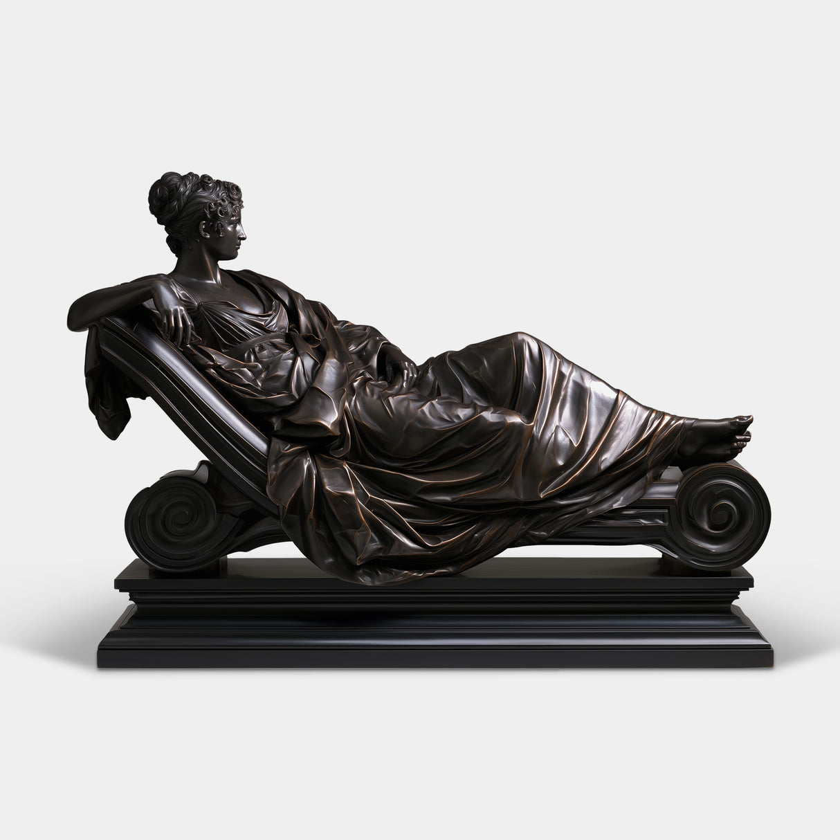 Bronze tabletop sculpture shows a draped female reclining on scroll chaise lounge.