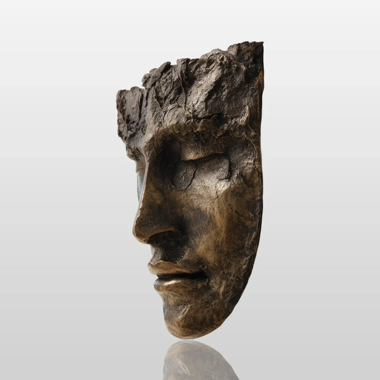 A textured bronze face wall mask sculpture is mounted on a plain white wall in a bright modern home.