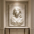 Laurel lady marble wall sculpture is embedded on fluted panel wall in a refined luxury interior space.