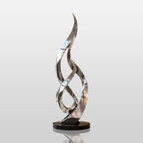 The tall twisted stainless steel sculpture stands in spacious double height luxury hotel lobby.