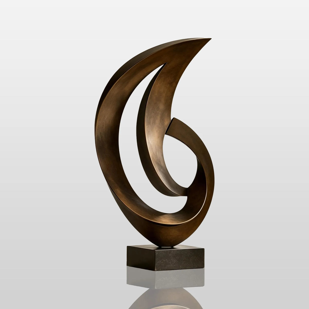 A bronze abstract sculpture stands on a wooden cabinet beside a door.