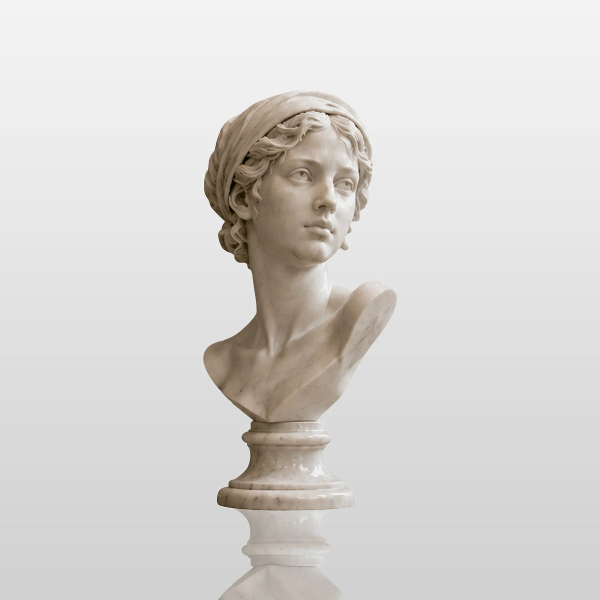 White marble female bust statue sits on a dark wooden round table in a living room.