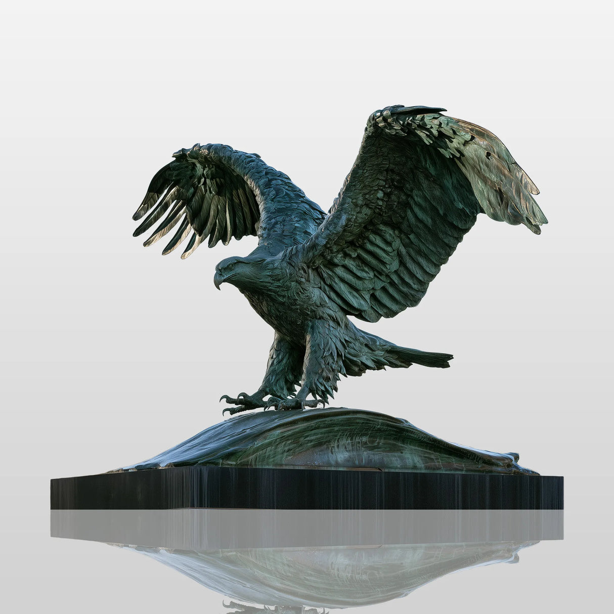 Patinated bronze eagle statue with wide spread wings stands on stone monument in the outdoor public space.