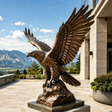 A bronze eagle statue stands on a terrace in front of a modern building.