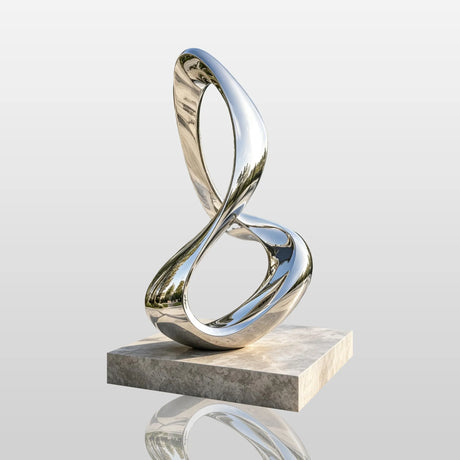 A stainless steel infinity loop sculpture stands on stone base beside a swimming pool.